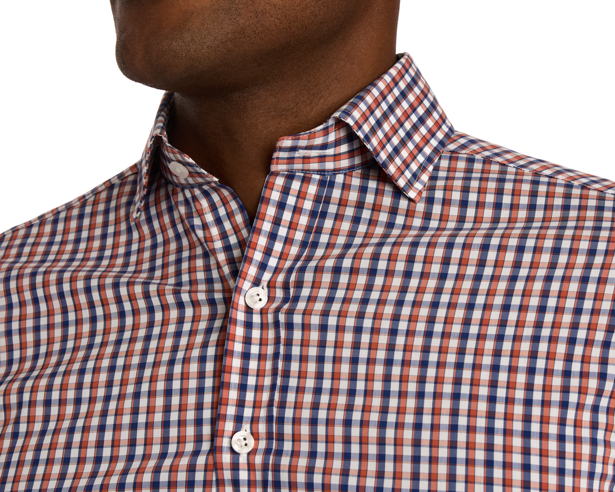 Close-up of a person wearing a green and blue checkered shirt on a white background
