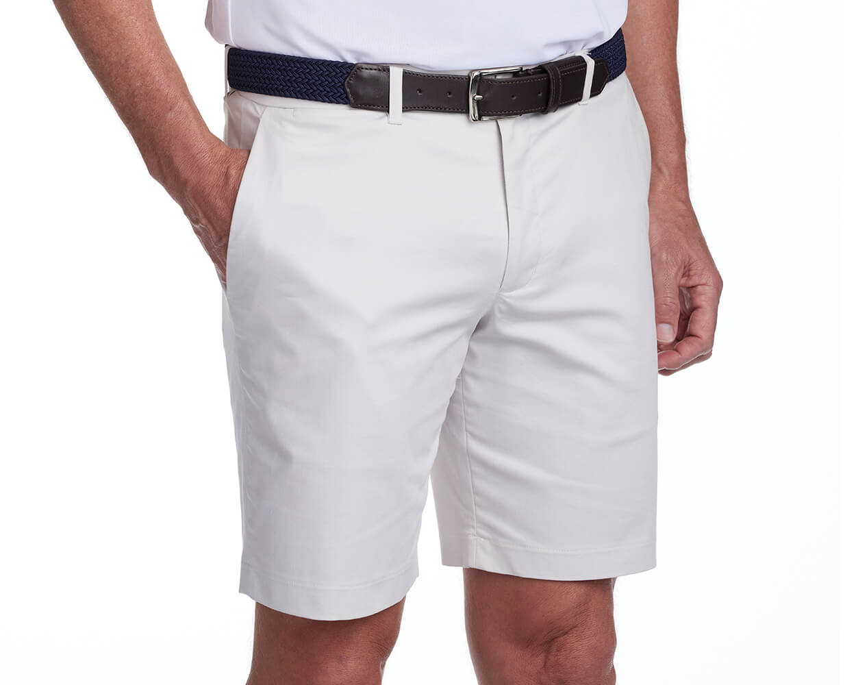 Front shot of Holderness and Bourne khaki golf shorts modeled on man's legs.