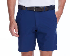 Front shot of Holderness and Bourne navy blue golf shorts modeled on man's legs.