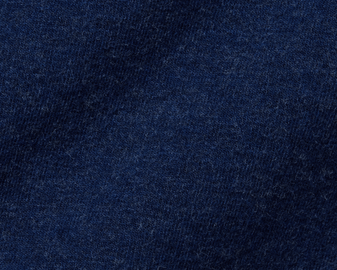 Close-up of The Lawson Hoodie: Heathered Atlantic, showcasing its tight-knit, dark-blue fabric texture, highlighting its ultra-soft, lint-speckled material.