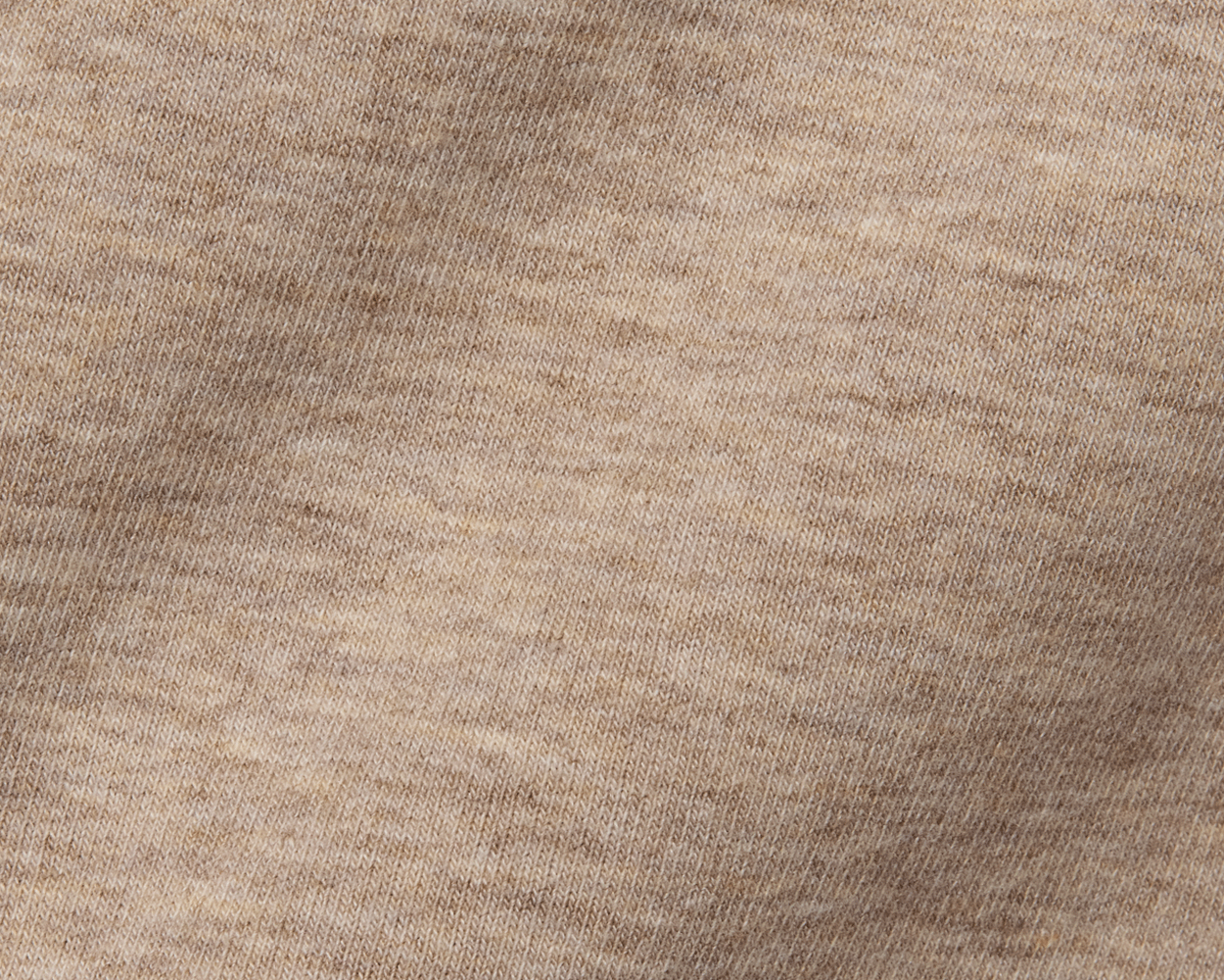 Close-up of The Kennedy Crewneck: Heathered Dune, showcasing its beige knit fabric with visible stitches, highlighting the soft texture and durable cotton blend construction.