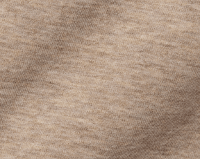 Close-up of The Kennedy Crewneck: Heathered Dune, showcasing its beige knit fabric with visible stitches, highlighting the soft texture and durable cotton blend construction.