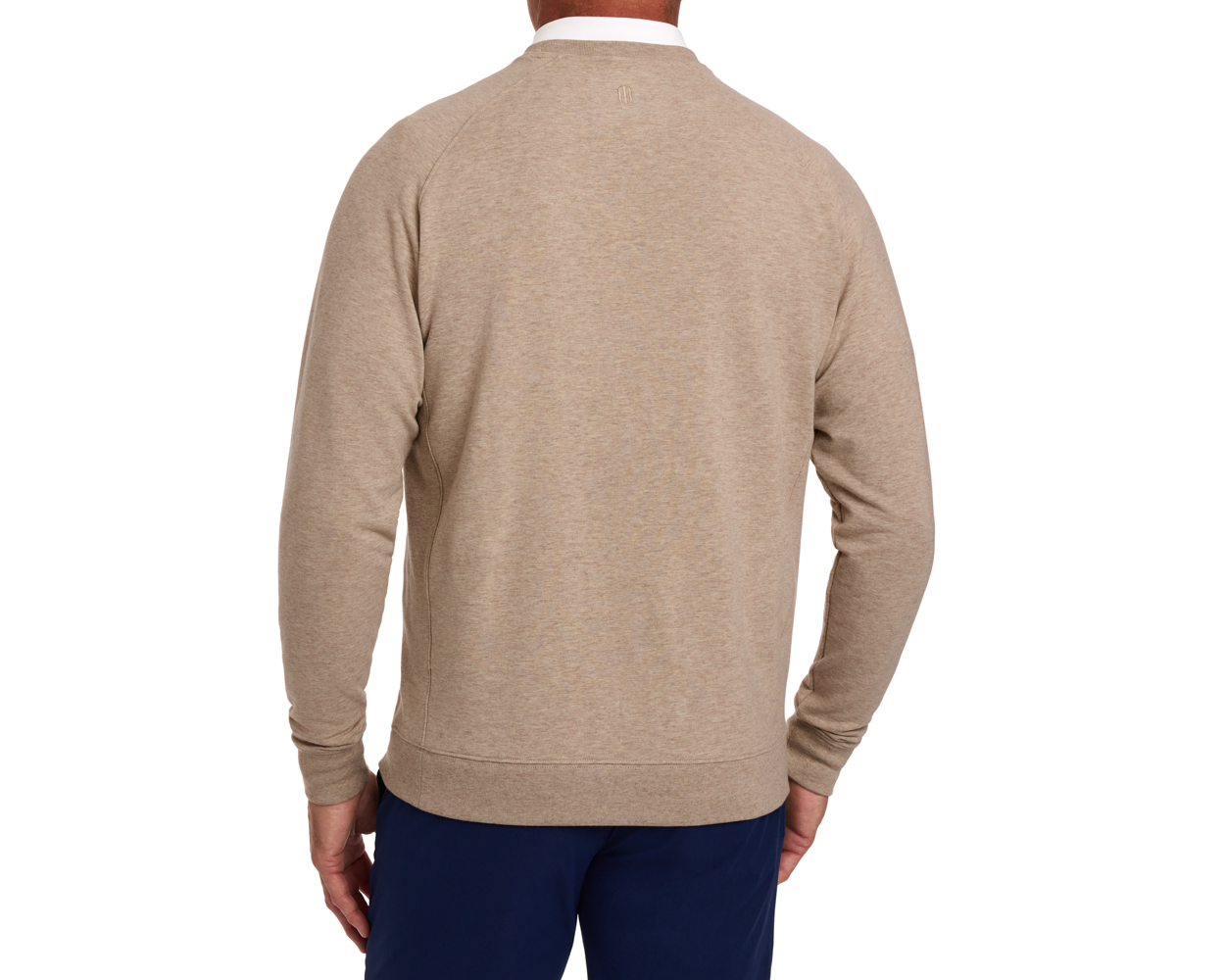 Back view of a man wearing The Kennedy Crewneck in Heathered Dune over a white-collared shirt, paired with navy pants, highlighting its comfortable fit.