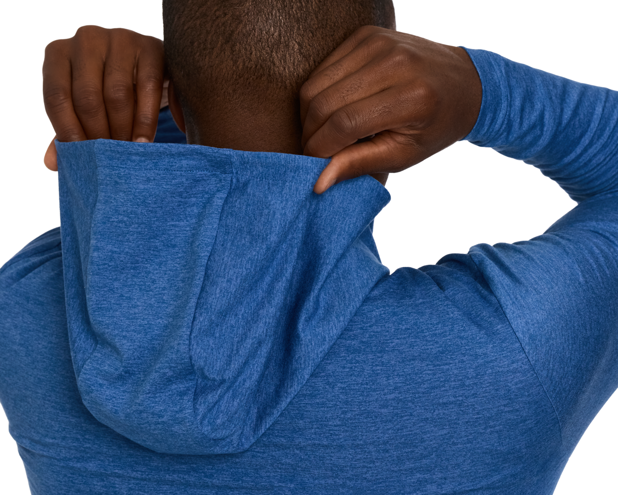 Person adjusting the hood of The Stowe Hoodie: Heathered Maidstone Blue, showcasing its lightweight, ultra-soft fabric with set-in sleeves and drop-tail hem.