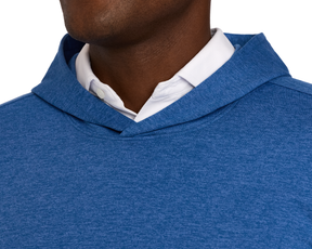 Close-up of The Stowe Hoodie in Heathered Maidstone Blue, showcasing its soft fabric and layered over a white collared shirt with visible hood and hem.