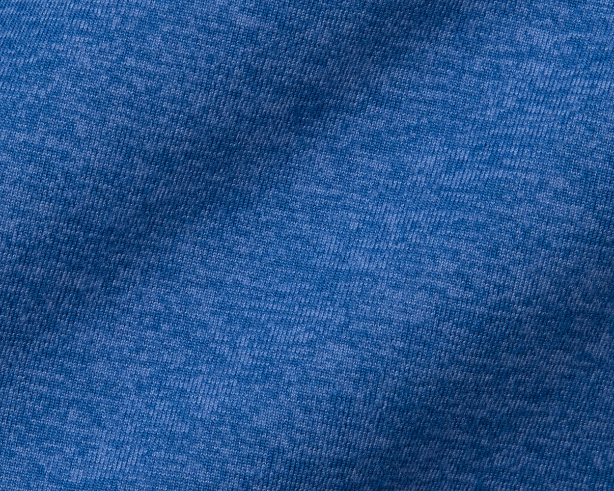 Close-up of The Stowe Hoodie in Heathered Maidstone Blue, showcasing the soft knit texture and fine loops of the premium performance fabric.