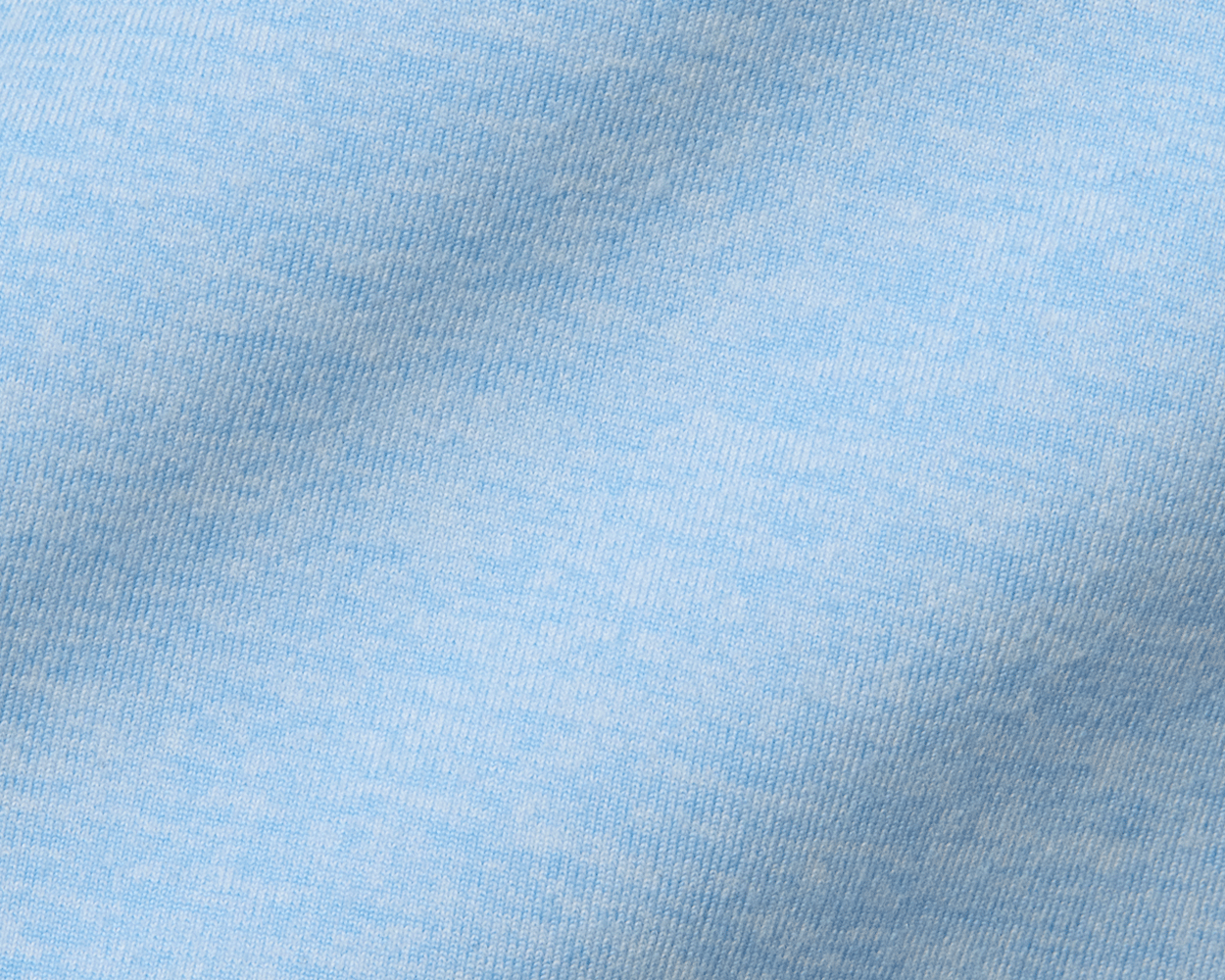 Close-up of The Stowe Hoodie in Heathered Vista Blue, showcasing its light-blue, finely knitted texture, highlighting its ultra-soft, performance fabric for comfortable layering.