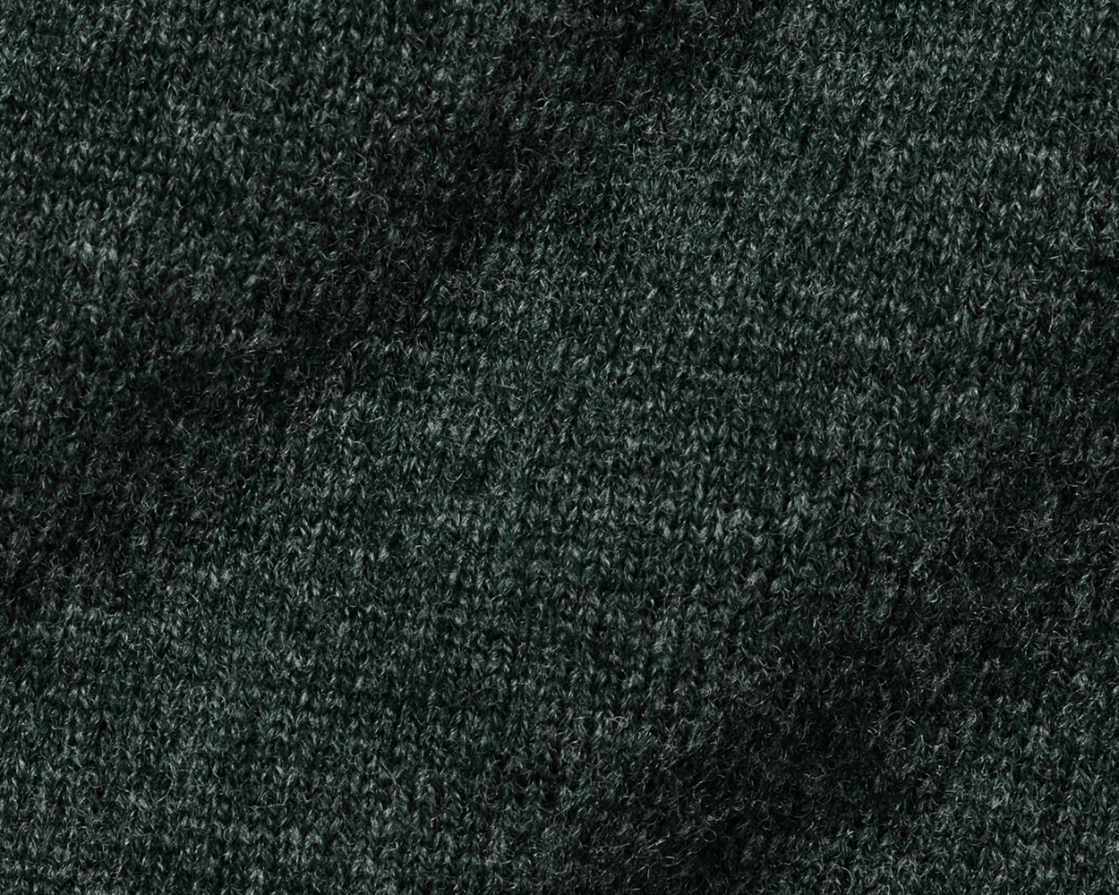 Close-up of dark green fabric texture