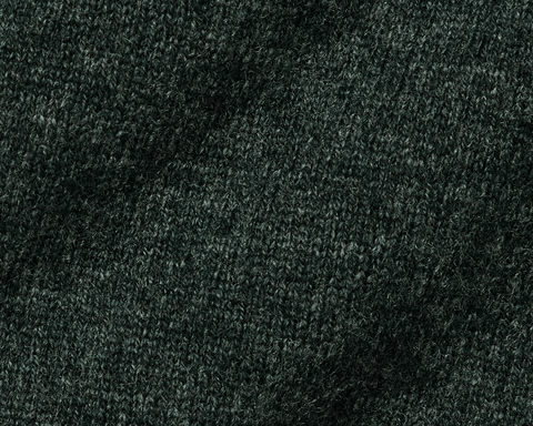Close-up of dark green fabric texture