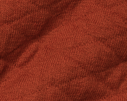 Close-up of textured Holderness & Bourne Men’s Rust Sweater fabric