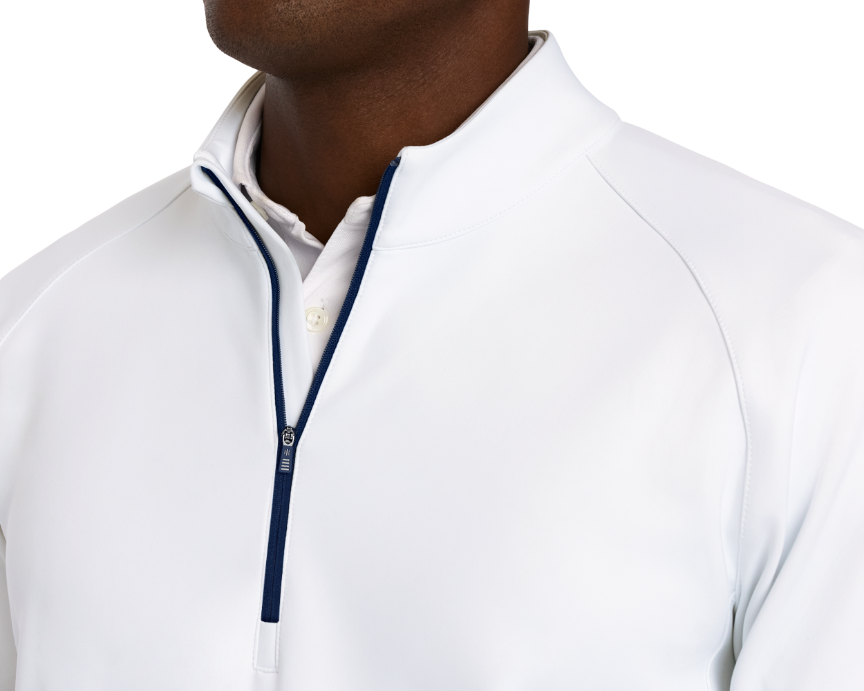The Rodgers Quarter-Zip: White, shown over a white polo, features a navy zipper, raglan sleeves, and a high collar, highlighting its stylish, functional design.