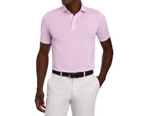 The Granville Shirt in pink and white stripes, worn by a dark-skinned man. Paired with light trousers and a woven belt, ideal for summer golf.