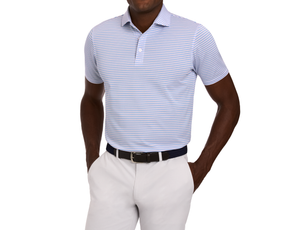 The Granville Shirt: Horizon Blue & Cabernet, a light blue and white striped polo, worn tucked into light trousers with a woven belt, ideal for summer golf.