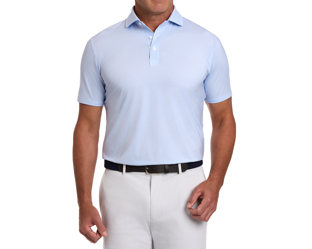 Model in The Norman Shirt: Vista Blue & Tudor, showcasing a light blue polo with a subtle basketweave print, paired with light-gray trousers and a dark belt.