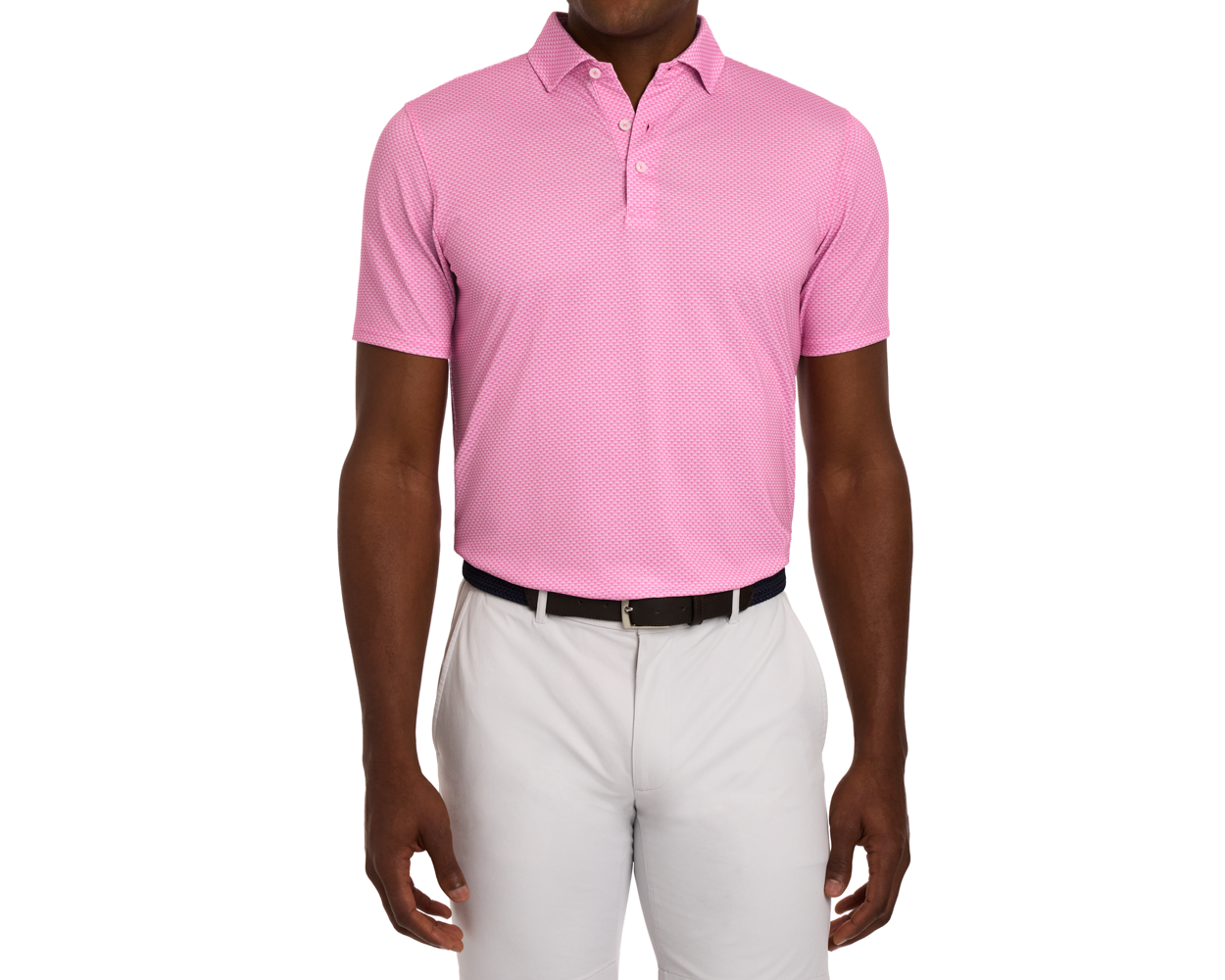 The Eaton Shirt: Belmont, a light-pink polo with abstract wave pattern, offers moisture wicking, UPF 30+ protection, paired with light-gray trousers.