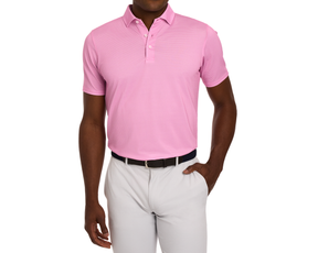Man models The Eaton Shirt: Belmont, a pink polo with abstract wave pattern, paired with light gray trousers. Polo features structured collar, three-button placket.