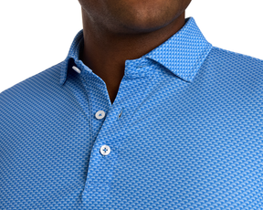 The Eaton Shirt: Horizon Blue with a textured wave pattern and white buttons, featuring a structured collar and designed for moisture wicking and sun protection.