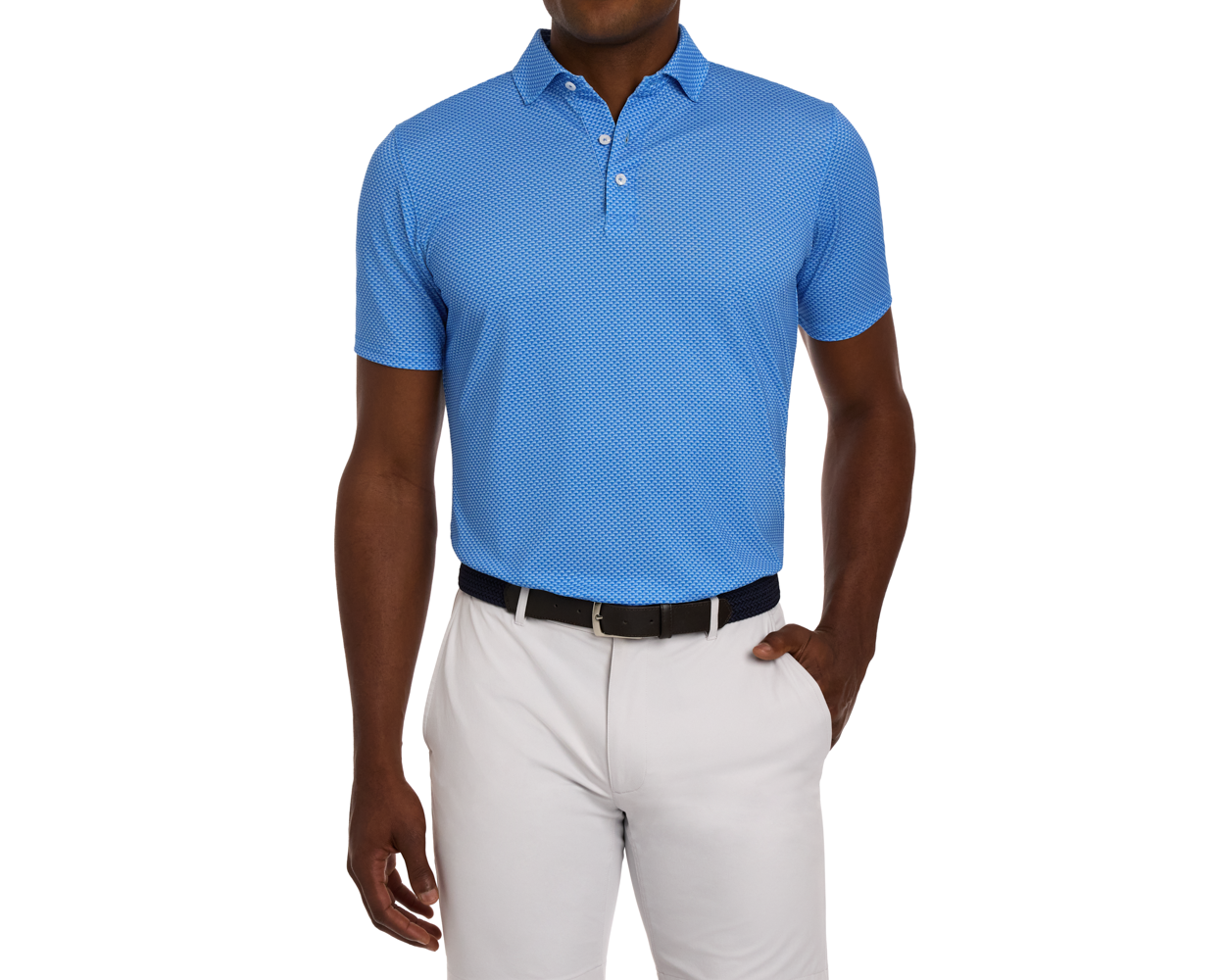 Man wearing The Eaton Shirt: Horizon Blue, short-sleeved polo with abstract wave pattern, tucked into light-gray trousers, featuring a dark belt and structured collar.