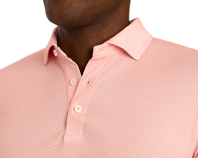 The Eaton Shirt: Nectarine featuring a textured pattern, structured spread collar, and two front buttons, designed for comfort, moisture wicking, and sun protection.