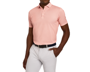 The Eaton Shirt: Nectarine, a short-sleeve polo with an abstract wave pattern, worn with light trousers and a braided belt, offers comfort and sun protection.