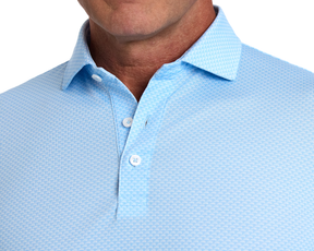 Close-up of The Eaton Shirt: Vista Blue, showcasing its textured fabric, structured spread collar, and fastened buttons, designed for moisture wicking and UPF 30+ protection.