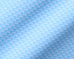 Close-up of The Eaton Shirt: Vista Blue, showcasing its light-blue textile with a scallop pattern, highlighting its soft, stretchy fabric for moisture wicking and sun protection.