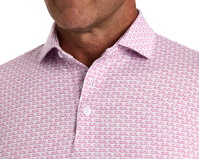 The Berkeley Shirt: Cabernet featuring pink animal silhouettes on white, seen on a man with an open collar and stubbly jawline.