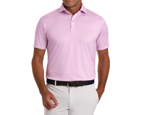 Man wearing The Berkeley Shirt: Cabernet, showcasing its bull-and-bear motif, paired with light gray pants and a dark woven belt with a silver-tone buckle.