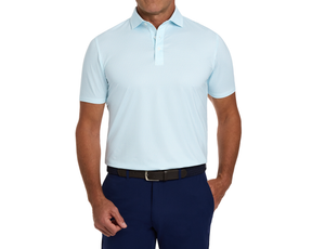The Walton Shirt: Harbor, featuring a subtle pattern, is styled with navy trousers and a dark woven belt, showcasing its AIRATION® breathable fabric and structured collar.