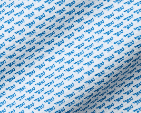 The Walton Shirt: Maidstone Blue features a white fabric with small blue bird pattern, crafted from AIRATION® fabric with a structured spread collar.