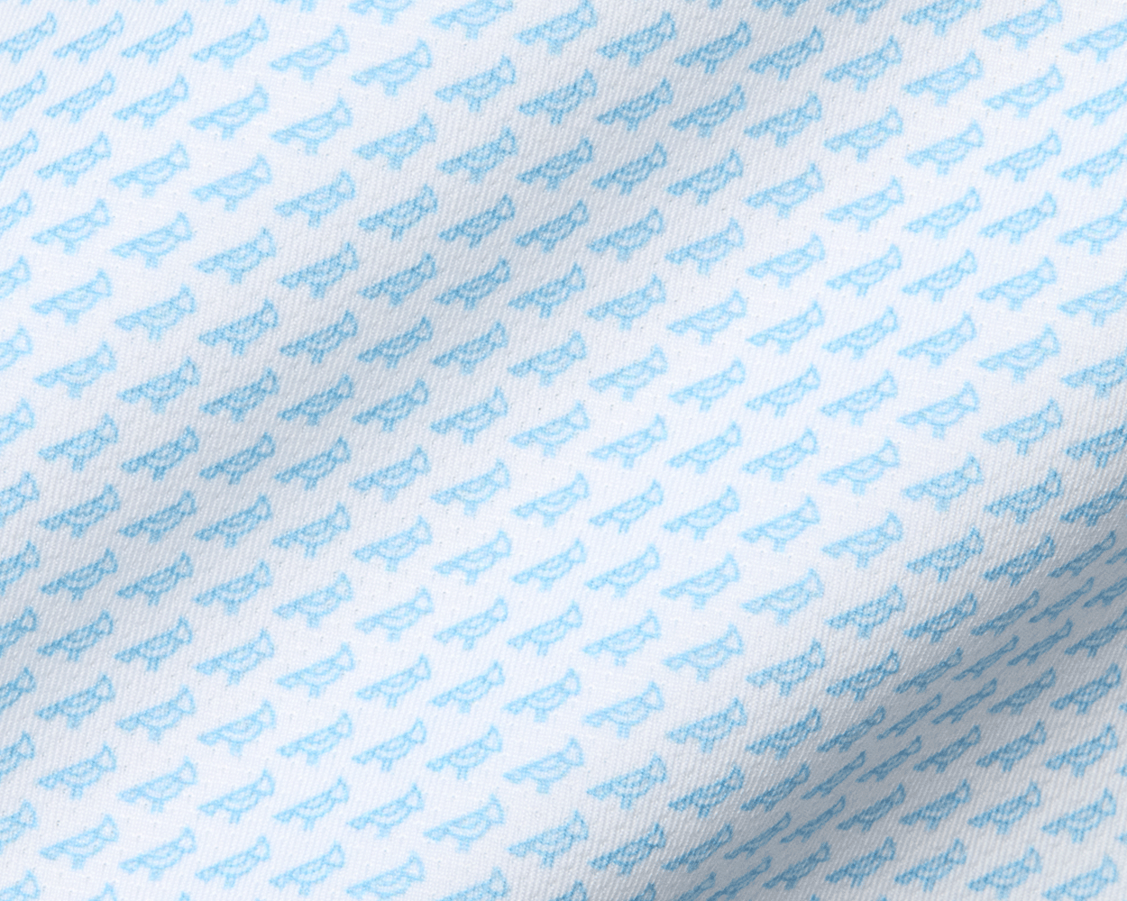 The Walton Shirt: Vista Blue features a white fabric with light-blue eyeglass frame motifs, showcasing AIRATION® fabric's texture and breathability for comfort and sun protection.