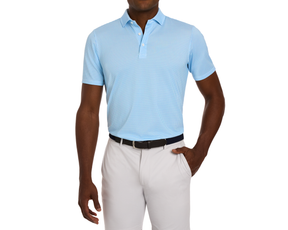 Man wearing The Lennox Shirt: Harbor & Maidstone Blue, featuring a subtle star pattern, tucked into light trousers. Perfect for golf with its breathable, moisture-wicking material.