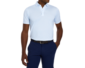 The Geiger Shirt: Vista Blue, a light-blue polo with a textured pattern, shown with navy trousers and a black woven belt, offering breathable comfort and UPF 30+ protection.