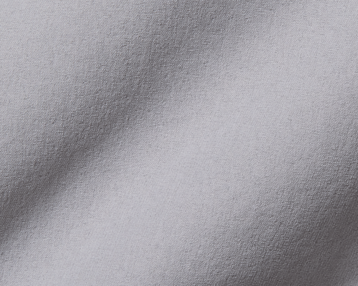 Close-up of The Harwood Boys Short: Gray, highlighting its finely textured, light gray fabric with a gentle fold, emphasizing its softness and performance features.