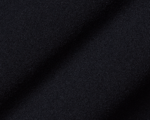 Close-up of The Jackson Boys Hoodie: Black, showcasing its textured, dark woven fabric, highlighting the smooth, soft 4-way stretch material and streamlined design.