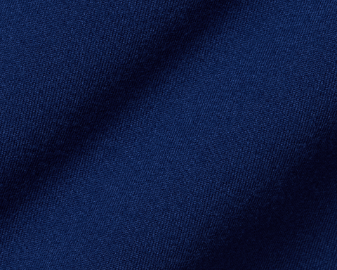 The Jackson Boys Hoodie: Navy, showcasing close-up of soft, dark blue knitted fabric with visible weave texture, highlighting its lightweight, 4-way stretch performance material.