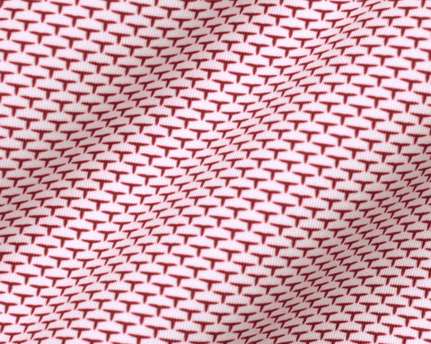 The Armfield Shirt: Liberty Red features a close-up of its red “T”-shaped motif on light fabric, highlighting the refined geometric pattern and texture.