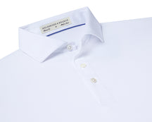 Folded Holderness and Bourne white golf polo shirt.