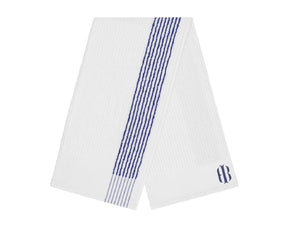 Folded white and blue striped Holderness and Bourne towel with logo embroidery.