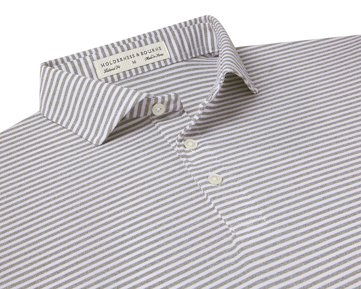 Folded Holderness and Bourne gray and white shirt.