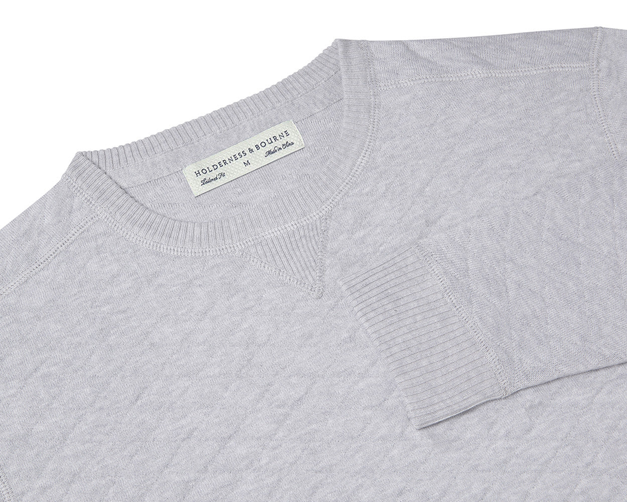 Folded Holderness and Bourne gray sweater.