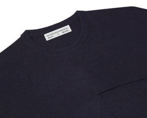 Folded Holderness and Bourne navy Merino & cashmere golf sweater.