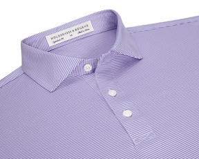 The Perkins Shirt: Tudor & White, a striped polo with a structured collar, three-button placket, and embroidered label, offers performance fabric with four-way stretch.