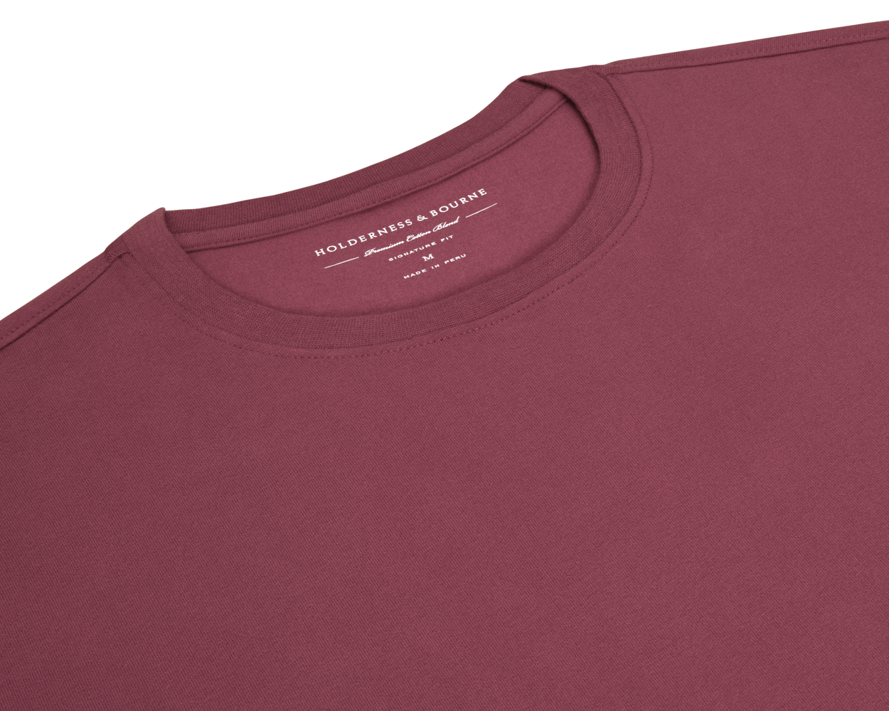 The Mason T-Shirt: Cabernet features a crew-neck style, showcasing the brand and fit details inside the collar, emphasizing comfort and durability.