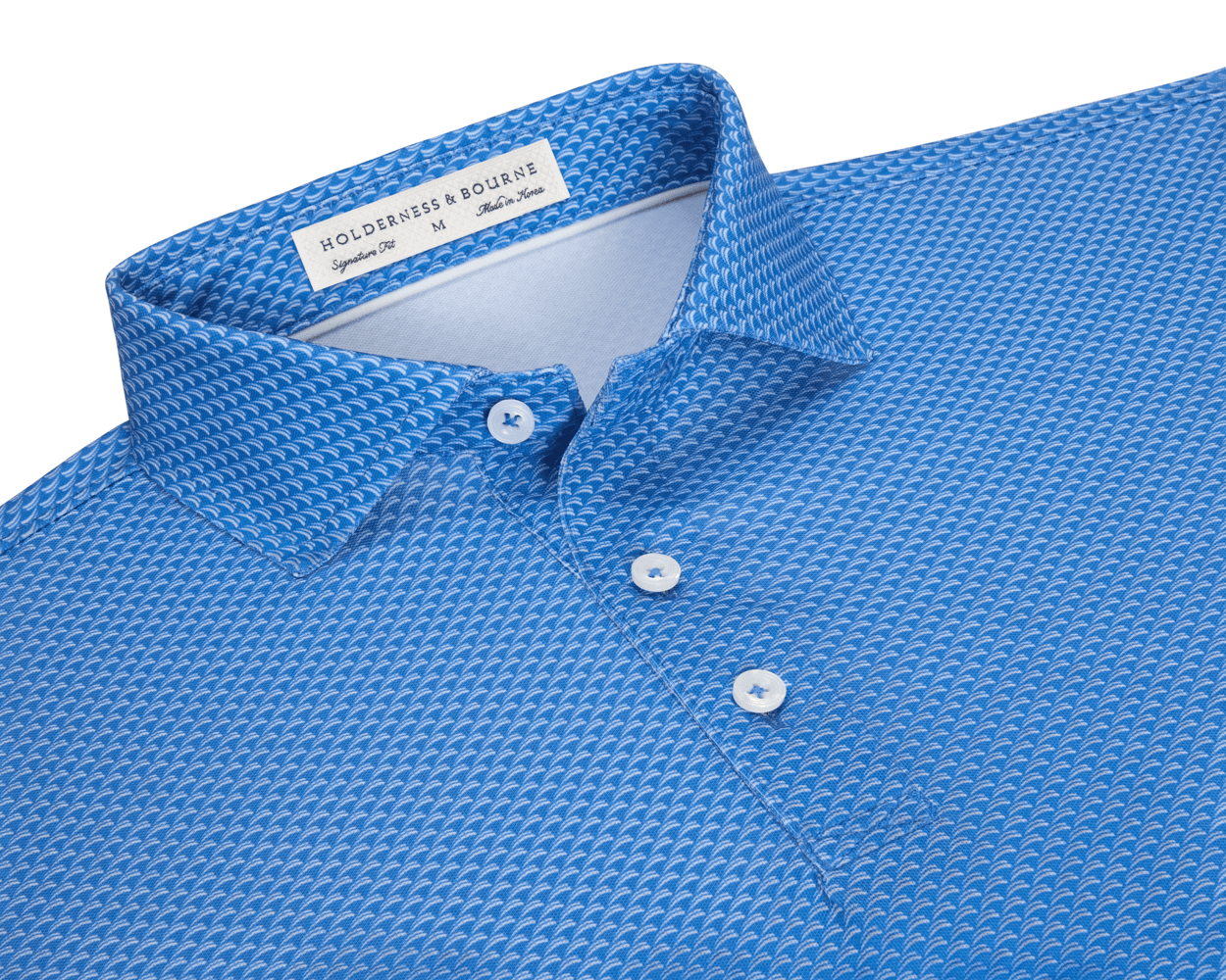The Eaton Shirt: Horizon Blue, featuring a structured spread collar, three white buttons, and an abstract wave pattern, crafted for comfort and sun protection.