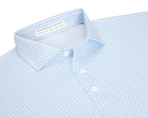 The Walton Shirt: Vista Blue, a white polo with light-blue micro-print, features a fold-over collar and three-button placket, showcasing Holderness & Bourne's AIRATION™ fabric.