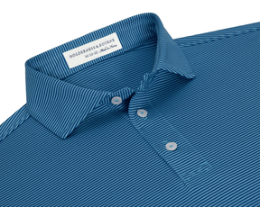 The Perkins Boys Shirt: Maidstone Blue & Harbor features a blue polo-style with white pinstripes, fold-over collar, and three-button placket, crafted from DryLuxe performance fabric.