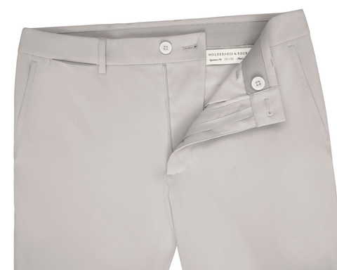 Holderness & Bourne Men’s Light Gray Golf Pants unbuttoned on a white background