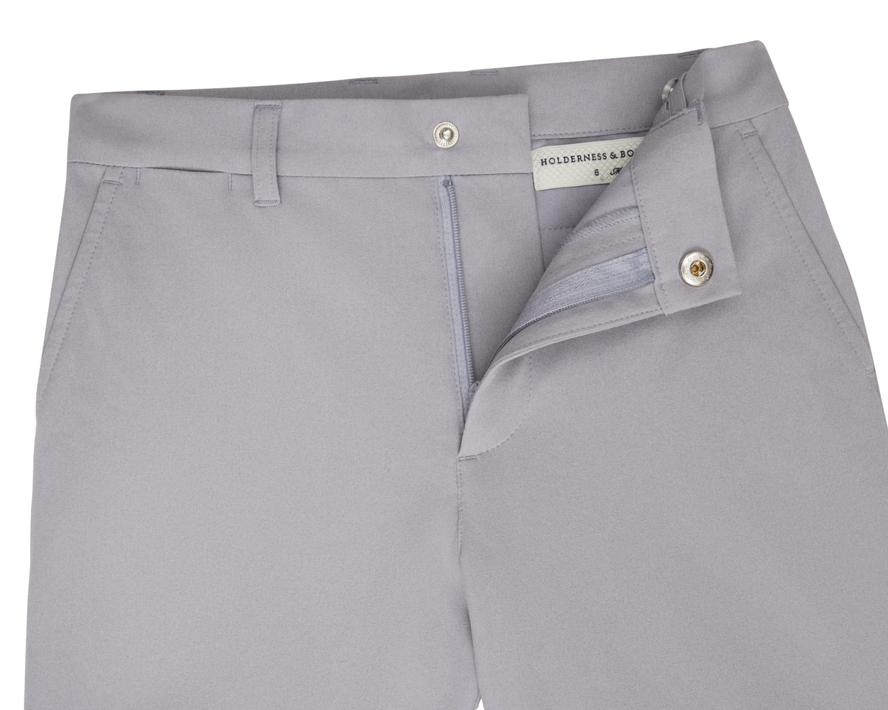The Harwood Boys Short: Gray, featuring a light gray design with a partially open zipper, a Holderness & Bourne label, and a non-slip waistband.