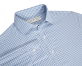 Blue checkered button up shirt with collar and button details on a white background